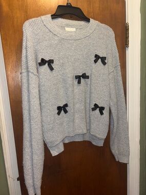 Pink Rose Light Gray Crewneck Sweater with Black Bow Appliqués
